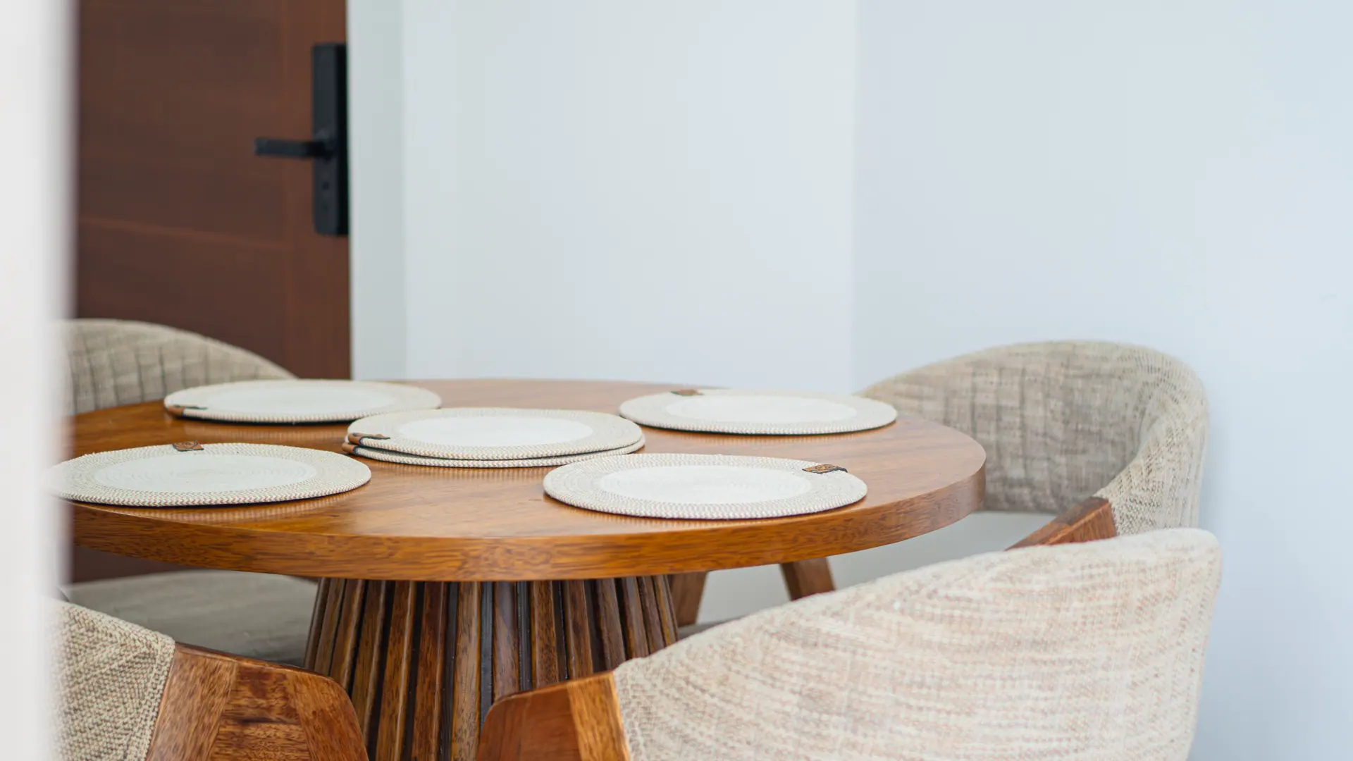 Dining table laid in a short-term rental apartment managed by Maison Nova in Lima
