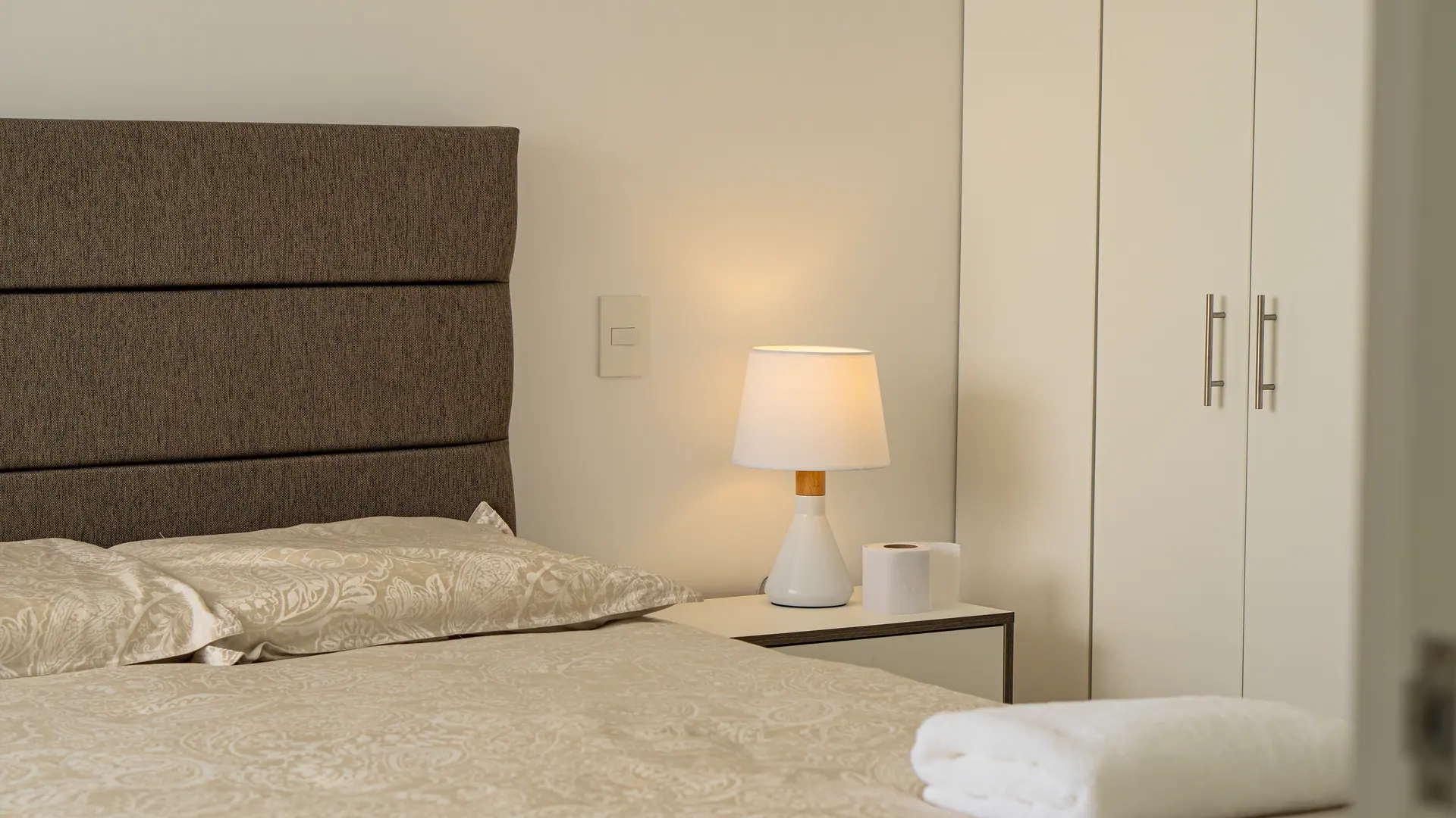 Bedroom detail photographed professionally for the listing of an apartment managed by Maison Nova