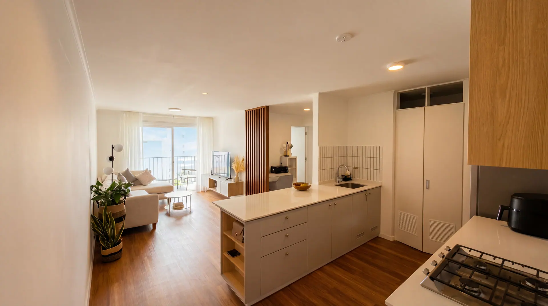 Open-plan living area and kitchen of a two-bedroom apartment managed by Maison Nova in Lima